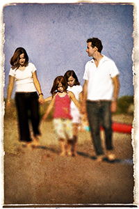 Family walking on the beach at Ward's Island